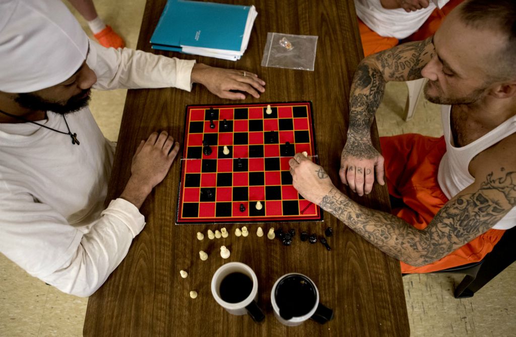 Best of Show - Jessica Phelps / Newark Advocate, “Life Locked Up in the County Jail”Zachary Grimmett-Anderson (left) and Joel Davis (right) play a game of chess in the recreation room at the Coshocton County Justice Center November 24, 2020. The jail is the second least compliant in the state of Ohio.There are no programs for inmates. The recreation room has been converted into a bunk room with cots lining the walls. In the center of the room are two tables where inmates can play either chess or cards. 